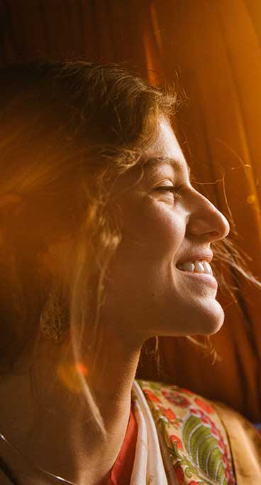 Woman smiling riding a bus